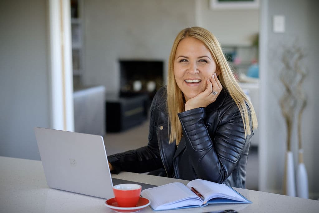 Brigitta Warren at her desk, ready to talk about your next hire